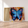 Пример картины в интерьере Акварельная бабочка синяя 2 Раскраска картина по номерам на холсте AAAA-RS004
